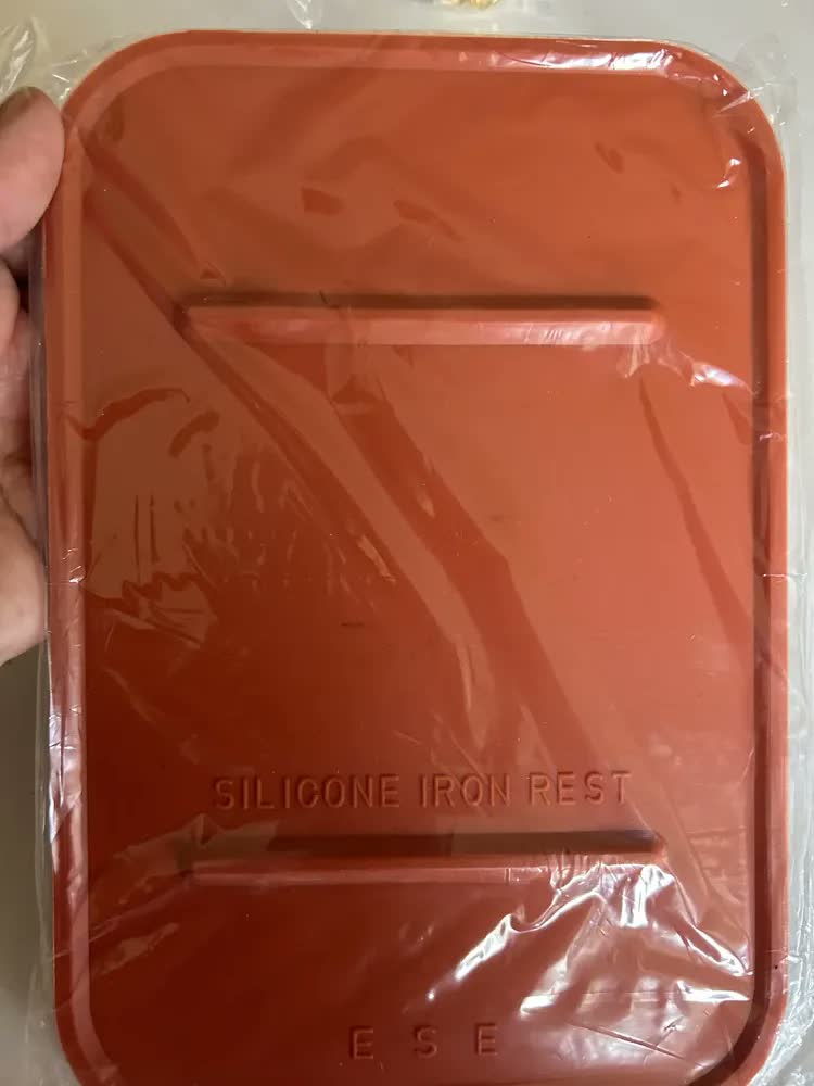 foto de Base Descanso Silicone P/ Ferro Passar A Vapor Industrial Cor Laranja