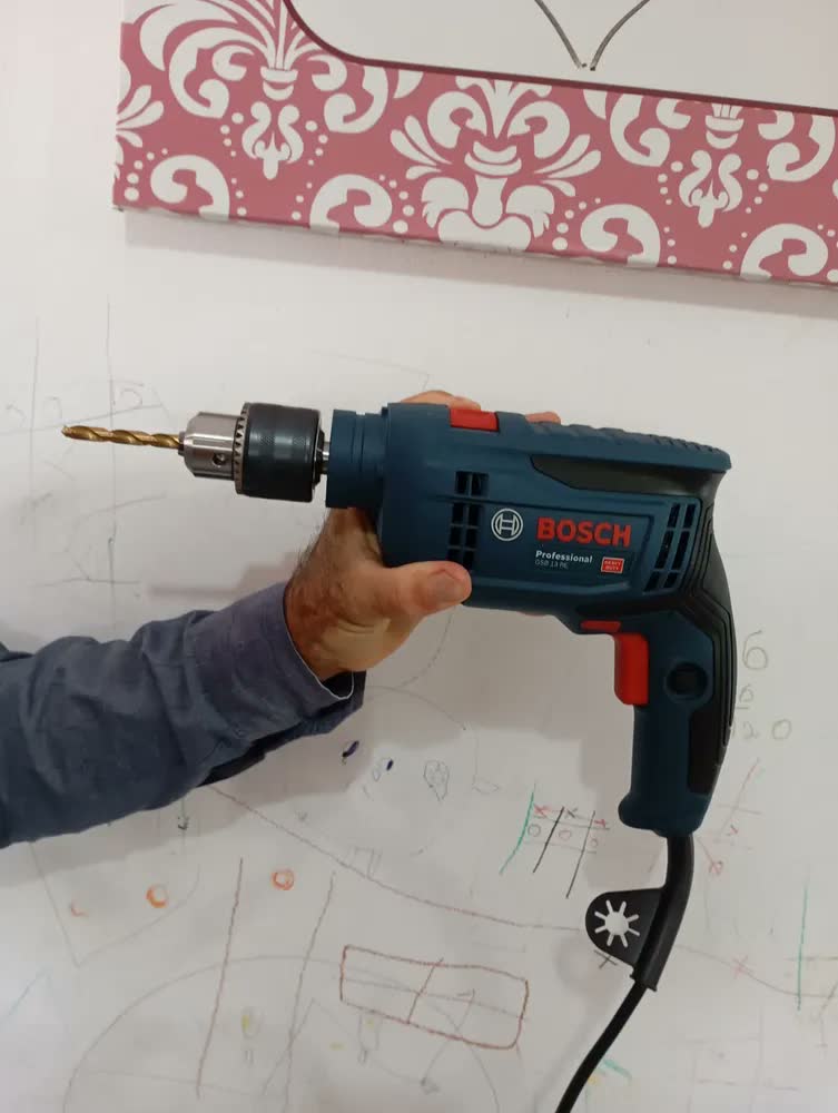 foto de Furadeira Impacto 750w Gsb 13 Re Bosch + Estojo 41 Pçs Evald Cor Azul