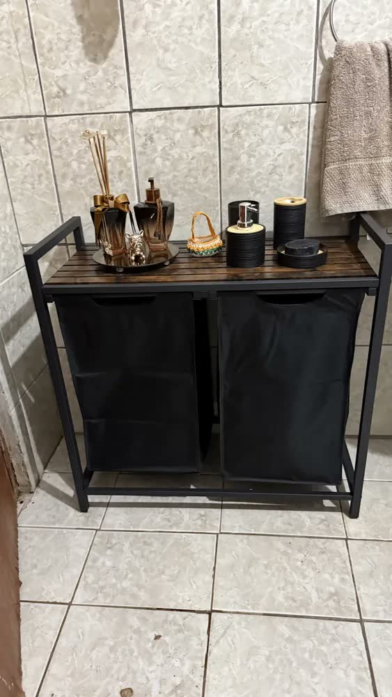 foto de Cesto de roupa suja Vasagle com tampa, 2 bolsas e 2 prateleiras, preto sólido