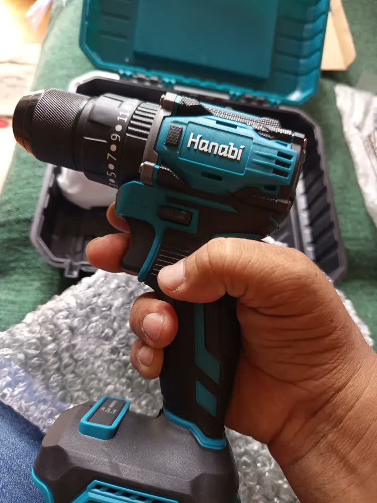 foto de Parafusadeira Furadeira de Impacto Hanabi CY-3003 Brushless 2 Baterias 21v Cor Azul-petróleo Frequência 60hz 45N·m com 25 níveis de ajuste