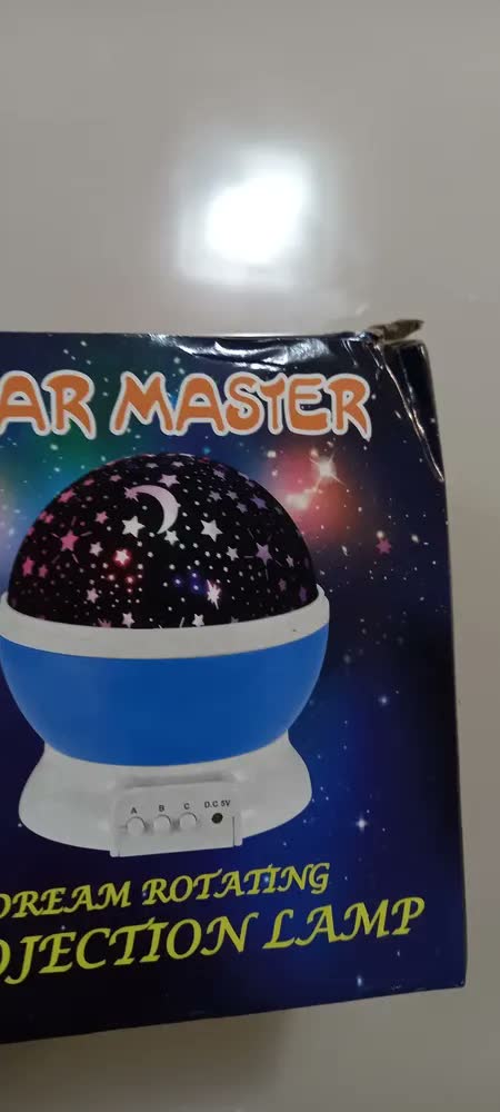 foto de Projetor LED Giratório Estrelas e Lua Quarto Infantil Azul USB