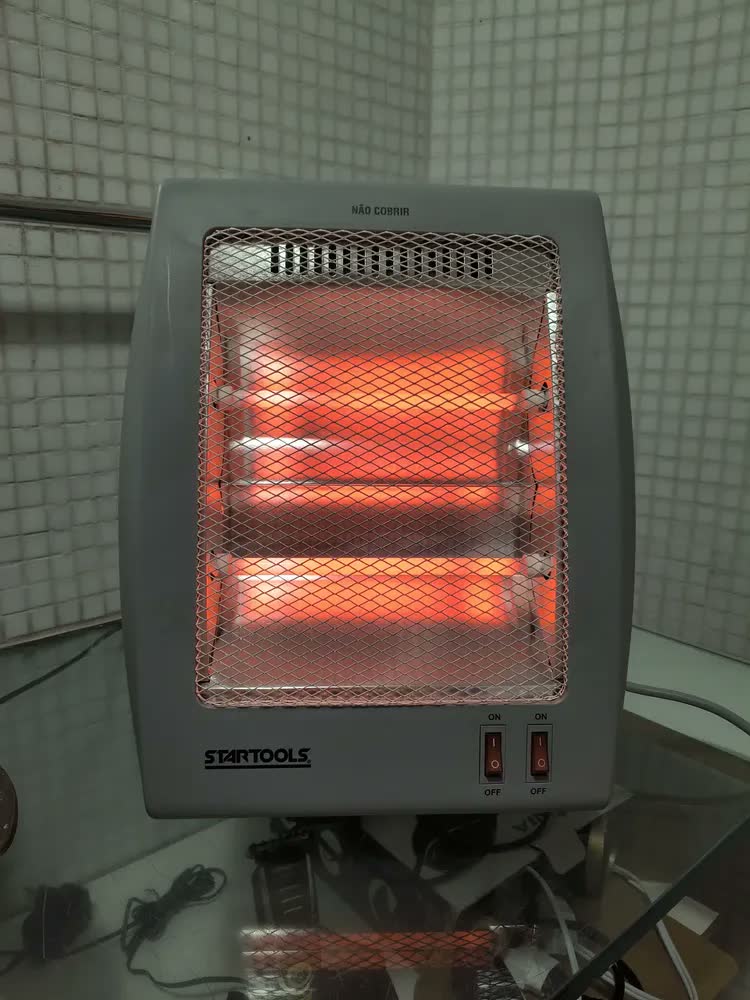 foto de Aquecedor Elétrico Compacto Domestico Quarto Sala Escritório Quartzo Com 2 Potências 400w 800w Portátil Shokki